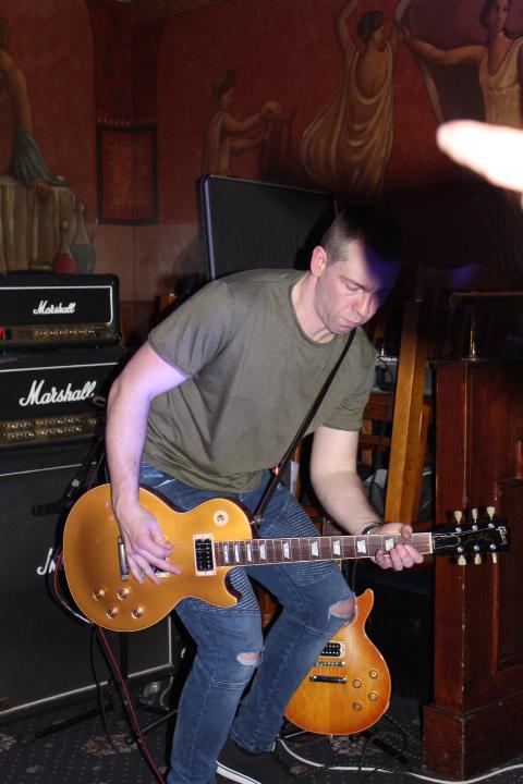 Backburner guitarist live on stage