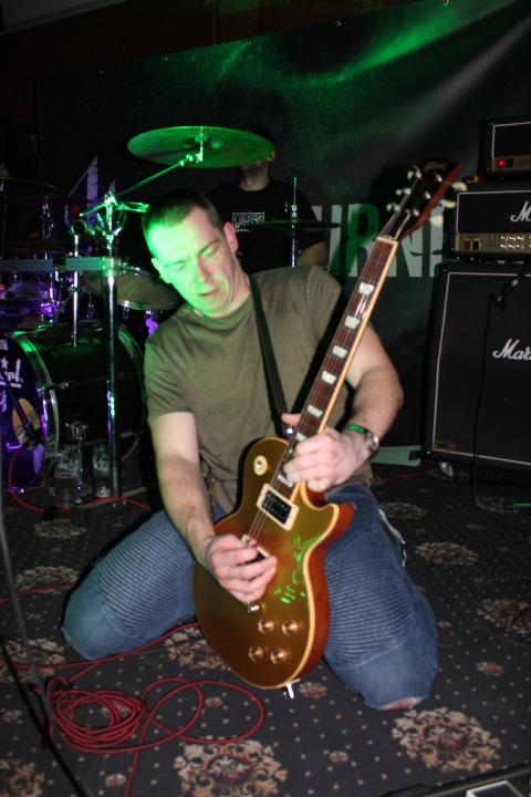 Backburner guitarist dramatic solo on knees